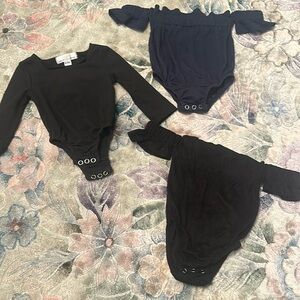 Baileys blossoms bodysuits 0-3 months. Two black one navy. Washed but Never worn